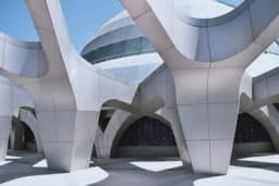 a modern building with a lot of arches and columns .